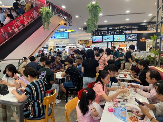 A supermarket's food court is crowded with customers at noon on May 1.