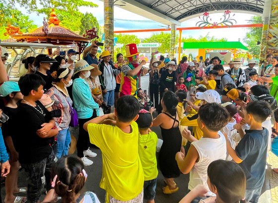 Children and tourists having fun at Suoi Tien Cultural Tourism Area on June 1.