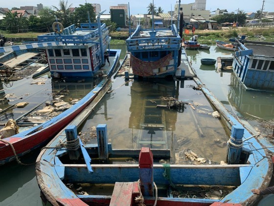 In the fishing village of Nghia An, the residents are seeking employment elsewhere to support their livelihoods, leaving behind the abandoned shipwrecks.
