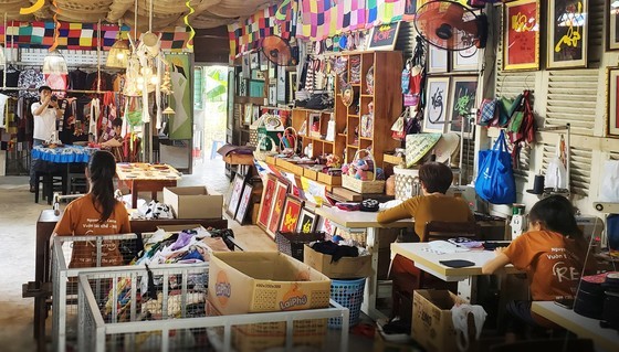 The group of individuals with disabilities gathers scrap fabrics and transforms them into captivating fashion products through upcycling.