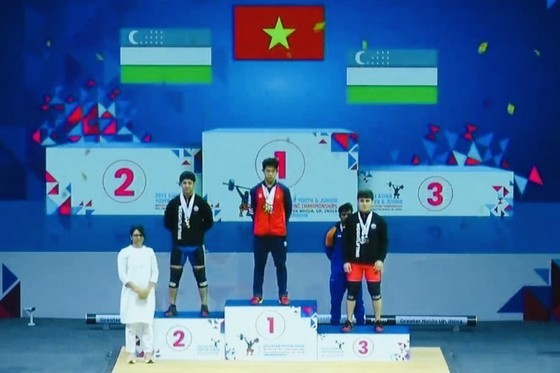 SEA Games 32 champion Tran Minh Tri secures two gold medals and one silver medal in the 67kg category for the junior championship.