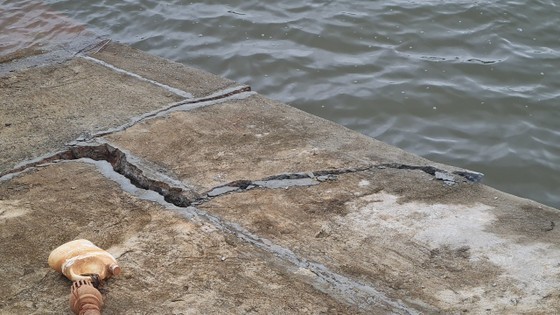 Numerous cracks along the dam's structure.