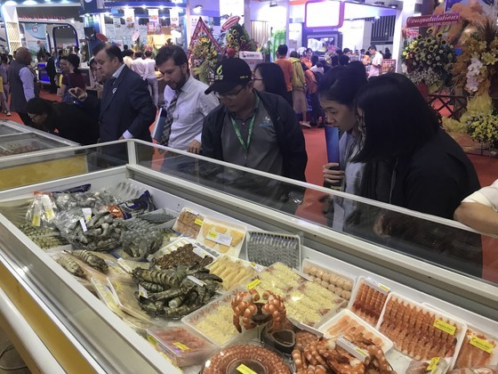 Foreign businesses visit the shrimp booth at the Seafood Fair held at the Saigon Exhibition and Convention Center in District 7, Ho Chi Minh City.