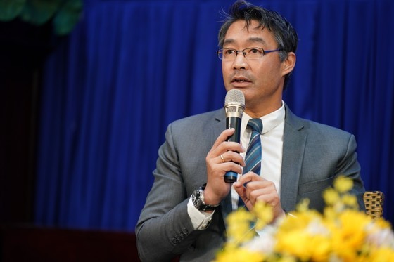 Mr. Philipp Rosler speaks at the event.