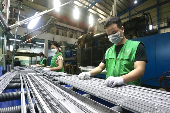 Minh Nguyen Company workers at the Saigon Hi-Tech Park inspect product details.