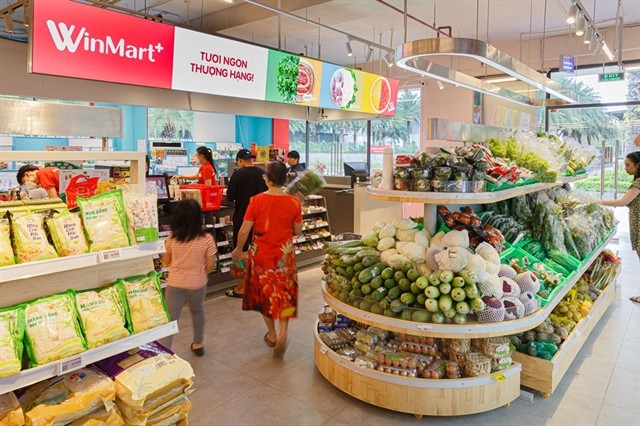 Customers shop at a WinMart store belonging to Masan Group. Masan announced on October 2 that Bain Capital, a global private investment firm, has agreed to invest at least $200 million in its equity at a price of VND85,000 per share. — Photo courtesy of Masan Group Customers shop at a WinMart store belonging to Masan Group. Masan announced on October 2 that Bain Capital, a global private investment firm, has agreed to invest at least $200 million in its equity at a price of VND85,000 per share. — Photo courtesy of Masan Group