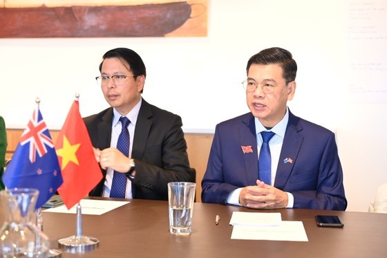 Mr. Nguyen Van Dung (R), Deputy Chairman of HCMC People's Council, speaks at the meeting.