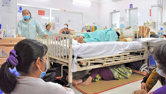 Patients' relatives have to sleep under the patients' beds at the Ho Chi Minh City Hospital for Traumatology and Orthopedics.