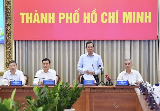 Mr. Phan Van Mai, Chairman of the People's Committee of HCMC, presides the meeting.