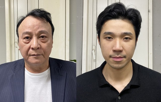 The defendants Do Anh Dung (L) and Do Hoang Viet