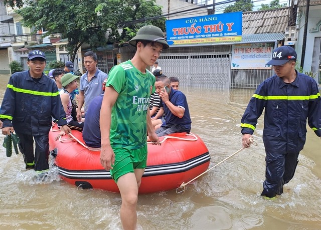 Local authorities bringing people from flooded areas in Ha Giang City to safer areas on Monday as Lo River water rises.