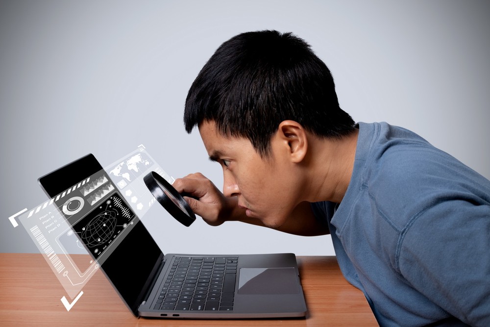 man-using-observing-laptop-with-magnifying-glass-search-virtual-model-map-world-location-point-2-1491-2572.jpg.jpg