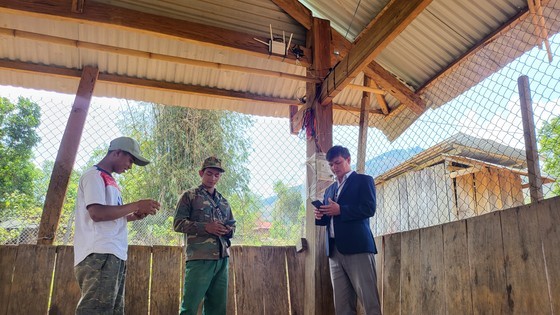 Dwellers of Mo Panh 1 Hamlet come to their communal house to access the Internet via free WIFI