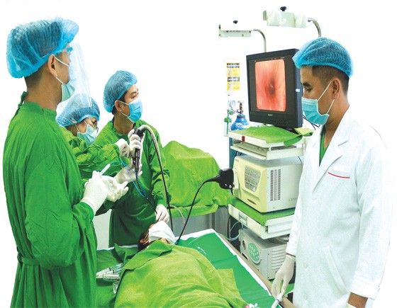 Vietnamese doctors in Cho Ray Phnom Penh Hospital are performing endoscopy for a Cambodian patient