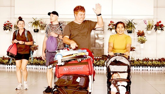 An international tourist group coming to HCMC on August 15 (Photo: SGGP) An international tourist group coming to HCMC on August 15 (Photo: SGGP)