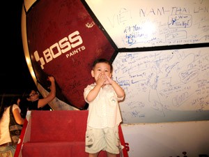 A kid joins the football atmosphere at the HCM City Youth Culture House Oct. 28 (Photo: Tuong Thuy)