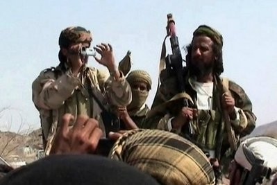 This undated file photo shoes men claiming to be Al-Qaeda members arrive to address a crowd in Yemen's southern province of Abyan. (AFP photo)