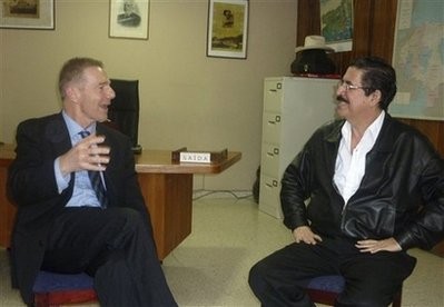 Craig A. Kelly, left, US Deputy Assistant Secretary of Western Hemisphere Affairs, speaks with Honduras' ousted President Manuel Zelaya in Brazil's embassy in Tegucigalpa, Tuesday, Jan. 5, 2010.