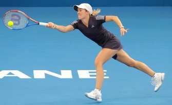 Justine Henin of Belgium hits a forehand return on the way to defeating Ana Ivanovic of Serbia in their semi-final match at the Brisbane International tennis tournament on January 8, 2010 (AFP photo)