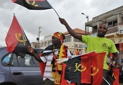 A street vendor sells Angolan flags and Angola national football team mementoes in Luanda. (AFP file)