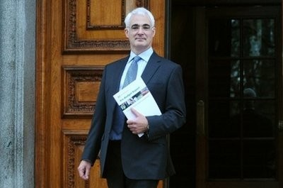(AFP file) Britain's Chancellor of the Exchequer Alistair Darling poses for photographs with his pre-budget report outside the Treasury, in London, in December.