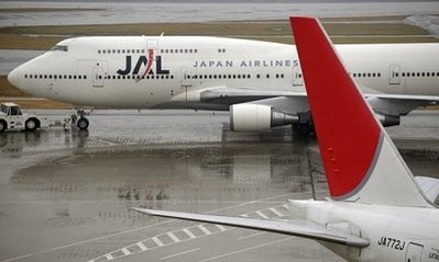 A Japan Airlines aircraft taxis at Haneda International airport in Tokyo. Shares in ailing carrier Japan Airlines plunged by 81 percent to just seven yen in early trade on Wednesday, hit by a flood of sell orders amid fears it will be delisted from the bourse.