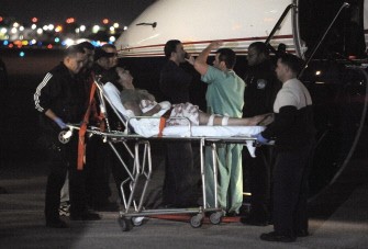 University of Miami students are flown in from Haiti a day after an earthquake caused major damage in the Caribbean nation, at Fort Lauderdale's Executive Airport on January 13, 2010 (AFP photo)