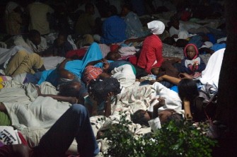 People sleep on a square in Port-au-Prince's Petionville district on January 13, 2009, one day after the eartquake hit the Haitian capital. AFP photo