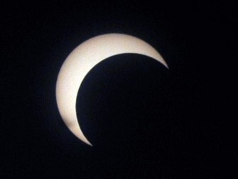 The moon begins to obstruct the view of the sun from earth in Colombo on January 15, 2010. The longest lasting solar eclipse of the last millenium was first visible in Sri Lanka's north and northeastern areas.