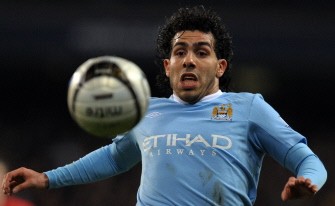 Carlos Tevez chases the ball against Manchester United during their English League Cup semi final first leg football match at The City of Manchester Stadium in Manchester on January 19, 2010. AFP PHOTO