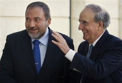 U.S. Mideast envoy George Mitchell, right, stands with Israeli Foreign Minister Avigdor Lieberman, during their meeting in the foreign ministry in Jerusalem, Thursday, Jan. 21, 2010.