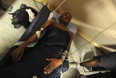 Wismond Exantus lies in a camp bed in a French field hospital in Port-au-Prince. AFP photo