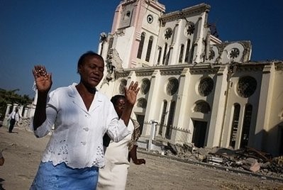 Haitians take part in a mass outside the ruined cathedral in Port-au-Prince.