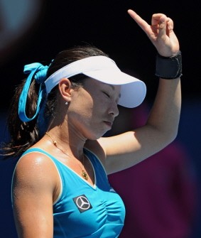 Zheng Jie gestures while playing Maria Kirilenko of Russia in their singles quarter-final match on day nine of the Australian Open in Melbourne on January 26, 2010. AFP PHOTO