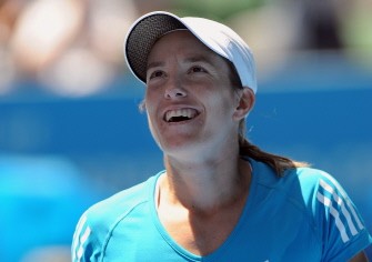 Justine Henin smiles as she celebrates her victory over Nadia Petrova of Russia in their women's singles quarter-final match on day nine of the Australian Open in Melbourne on January 26, 2010. AFP photo
