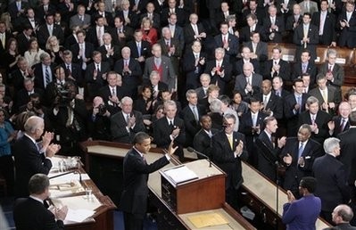 President Barack Obama waves before delivering his State of the Union address on Capitol Hill in Washington, Wednesday, Jan. 27, 2010.