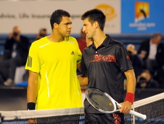 French tennis player Jo-Wilfried Tsonga (L) embraces Serbian opponent Novak Djokovic after victory in their quarter-final men's singles match against on the tenth day of play at the Australian Open tennis tournament in Melbourne early January 28, 2010. Tsonga won 7-6. 6-7. 1-6. 6-3. 6-1. AFP photo