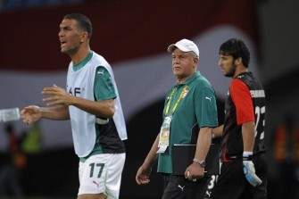 Rabah Saadane, Algerian coach(C) reacts during their semi final match of the African Cup of Nations CAN2010 at the Ombaka stadium in Benguela, Angola on January 28, 2010. Egypt won 4-0. AFP photo