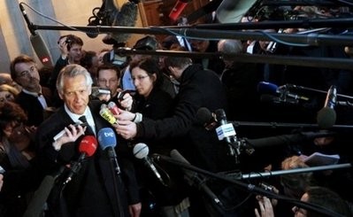Former French prime minister Dominique de Villepin speaks to the press as he leaves court in Paris. AFP photo