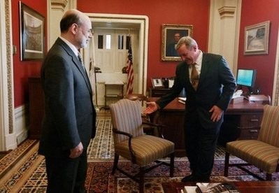 Federal Reserve Chairman Ben Bernanke (L) is greeted by Sen. Richard Durbin before a meeting at the US Capitol in Washington DC. on Jan. 28 (AFP photo)