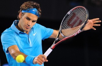 Federer hits a return against Jo-Wilfried Tsonga of France in their men's semi-final match on day 12 of the Australian Open tennis tournament in Melbourne on January 29, 2010. Federer won 6-2, 6-3, 6-2 to advance to the final against Andy Murray. AFP PHOTO