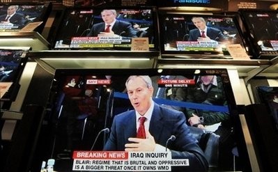 TV sets show former British prime minister Tony Blair giving evidence to the Iraq War Inquiry. (AFP photo)