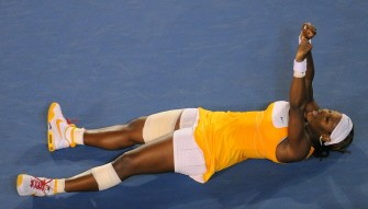 Serena Williams falls to the floor after victory in her women's singles final match against Justine Henin. AFP PHOTO