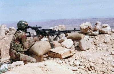 This undated handout picture released by the Yemeni army in November 2009 shows a Yemeni soldier manning a machine gun in Saada province. (AFP file)