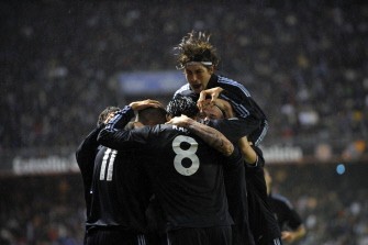 Real Madrid's players celebrate after scoring against Deportivo Coruna during a Spanish league football match at the Riazor Stadium in La Coruna on January 30, 2010. AFP PHOTO