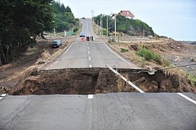 A gap in a road caused by Saturday's earthquake and the ensuing tsunami in Pulluhue, 320 km south of Santiago, Chile. AFP photo