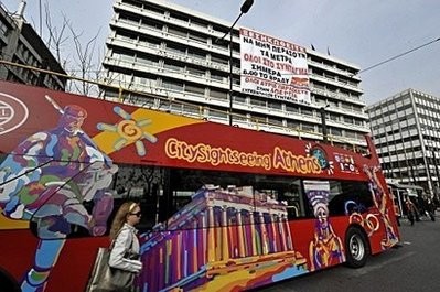 A huge banner, reading: Rise up so the measures will not pass and calling for demonstrations, hangs from the Finance Ministry building in Athens