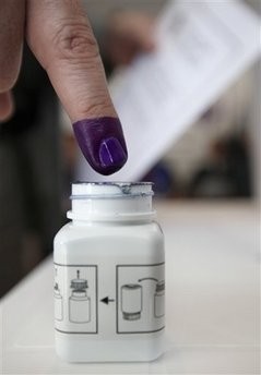 An Iraqi man, inks his finger after casting his vote at a polling center in Beirut, Lebanon, on Friday March 5, 2010.