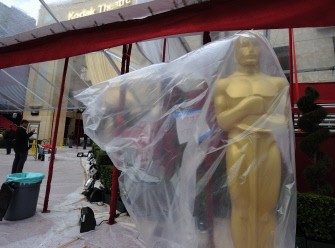 An Oscar statue stands covered in the rain on the day before the 82nd Academy Awards at the Kodak Theater in Hollywood, California on March 6, 2010. AFP PHOTO