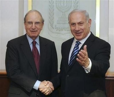 Israel's Prime Minister Benjamin Netanyahu (R) stands with U.S. envoy George Mitchell during their meeting in Jerusalem March 7, 2010